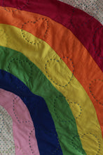 Load image into Gallery viewer, Rainbow pattern inset into a multicoloured polka dot fabric. Quilted with heart shapes in a blue &amp; green thread. 
